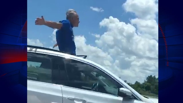 Florida man stands through sunroof while driving down I-4