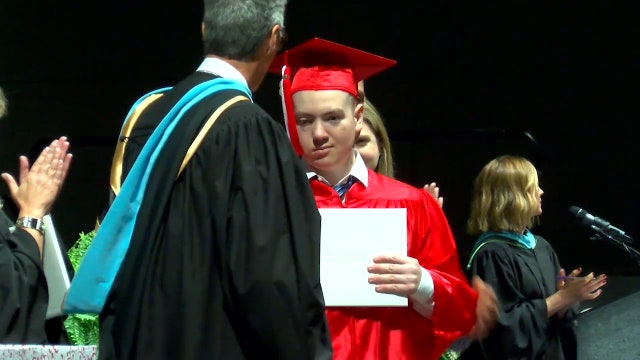 Daytona Beach grad walks across stage after years in wheelchair