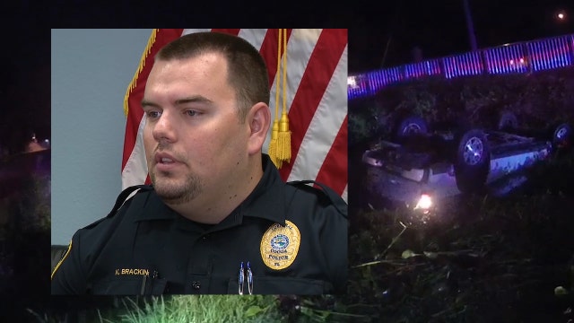 Off-duty officer rescues 2 from overturned car