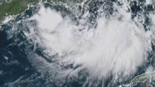 Weakened Barry rolls into Louisiana, drenches Gulf Coast