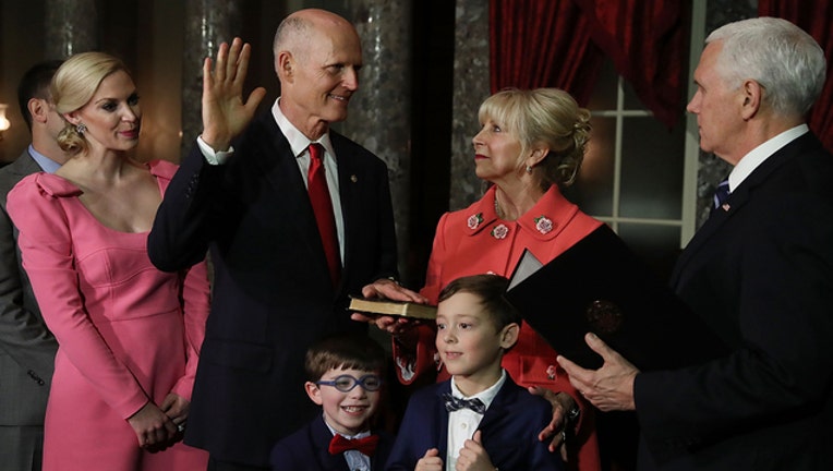 091a476c-GETTY-Rick-Scott-sworn-in-Senate-402429