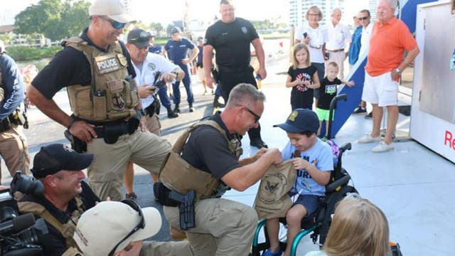 Florida boy, 5, battling aggressive brain cancer gets to patrol with Coast Guard, police
