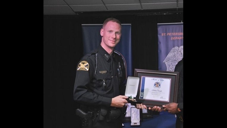 5508dc98-Officer Matthew Enhoffer medal of valor_1568934492243.jpg_7666980_ver1.0_640_360_1569073431739.jpg-402429.jpg
