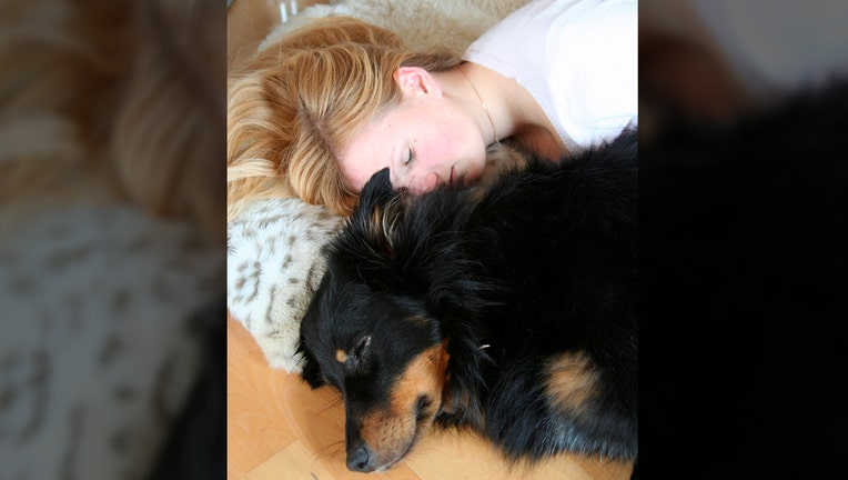 287c760d-GETTY-woman-and-dog.jpg