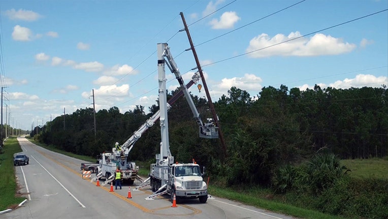 dd66977b-A crew with Duke Engergy works to restore power along County Rd. 635, in Sebring, Florida, after outages caused by Hurricane Irma. [Courtesy: Duke Energy]