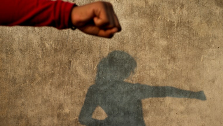 LUCKNOW, UTTAR PRADESH, INDIA - 2014/11/04: A young girl of the Red Brigade waits on the roof of a house to learn self-defense in a suburb called Madiyaon, in the city of Lucknow in India. The Red Brigade is a self-defense group that was founded in Lucknow, Uttar Pradesh, India by Usha Vishwakarma who was a victim of an attempted rape. She decided that something must be done to protect the insecurities and sexual violence against women. Thus creating the Red Brigade Lucknow with some partners to try and make the streets a safer place for women to roam. The Red Brigade mainly train young females the art of self-defense in order to help them feel safer. They are also attempting to help younger girls who are not allowed to go to school for fear that they may be raped on their way there by providing safety patrols so that younger girls can also be educated. The organisation is now receiving press coverage from all over the globe. (Photo by Jonas Gratzer/LightRocket via Getty Images)