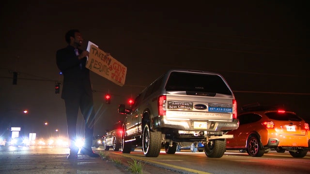 Man hits the streets, handing out resumes while turning down cash handouts