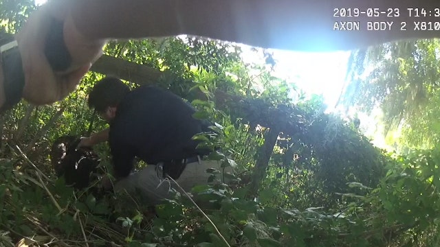Body cam shows officer pointing a gun at a suspect's head