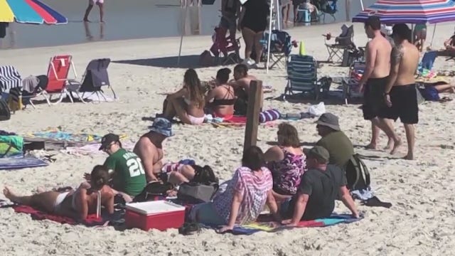 New Smyrna Beach packed with people despite coronavirus outbreak, push to keep distance from others