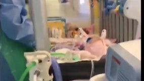 6-month-old baby cheered by staff while leaving isolation after recovering from COVID-19