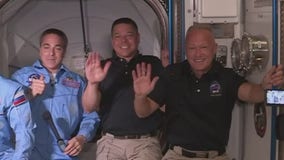 Astronauts board International Space Station after docking SpaceX Crew Dragon spacecraft