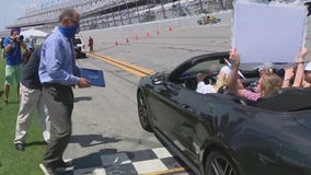 Flagler County graduates drive across Daytona International Speedway finish line, receive diplomas