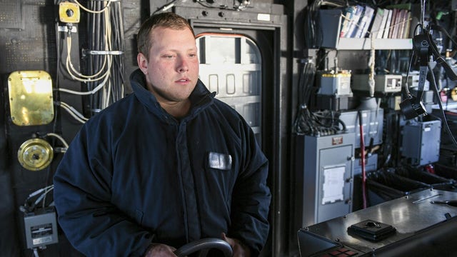 Gainesville sailor Cody Bowman steers the USS Normandy while at sea with the Harry S. Truman strike group