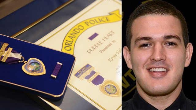 Officer Kevin Valencia receives purple heart, shows signs of improvement
