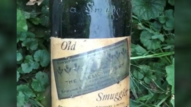 Couple find Prohibition-Era booze hidden behind house walls
