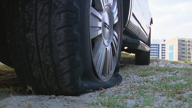 Man accused of slashing tires on dozens of vehicles in hotel parking lots