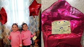 Stranger surprises twins with gifts, a puppy after wish-list balloon to Santa found 650 miles away
