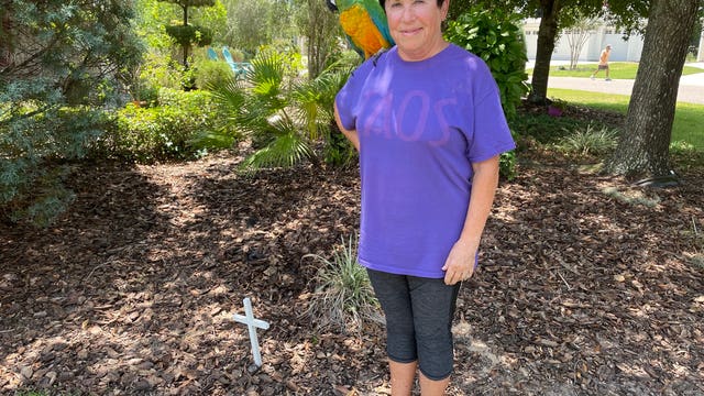 Resident says HOA in The Villages is suing her for displaying cross, lawn ornaments