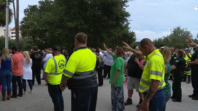 Parade of tow trucks drive by hospital where Daytona officer is being treated