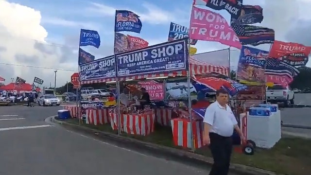 Supporters display 'Trump 2024' signs ahead of Florida rally