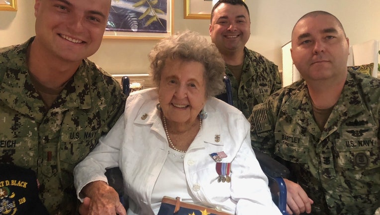 Ima Black with U.S. Navy personnel celebrating her 100th birthday