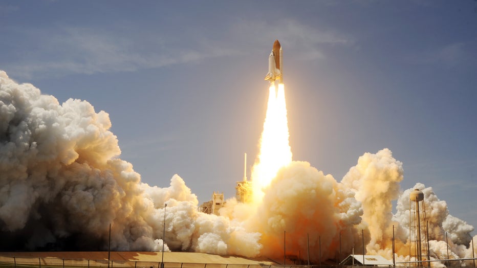 The Space Shuttle Atlantis lifts off May