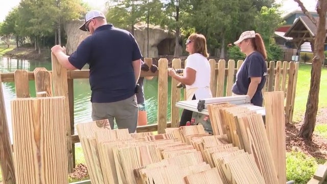 Volunteers donate time and skill to new fence at Give Kids the World