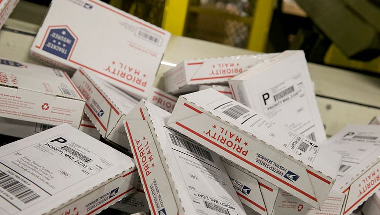 f5fd16e1-US Postal Service Experiences Busiest Day Of The Year As Holidays Approach