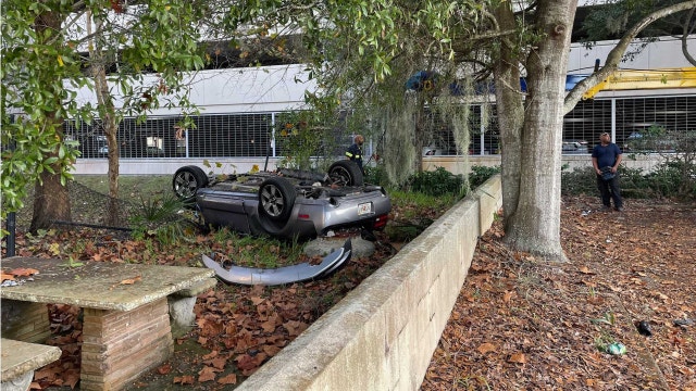 Driver hospitalized after launching vehicle off 8-story parking garage, police say