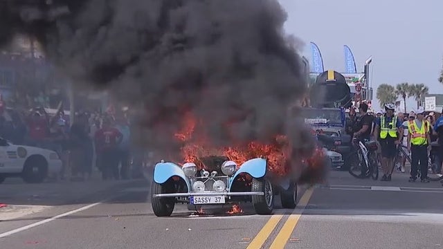 Classic car bursts into flames during Florida holiday parade