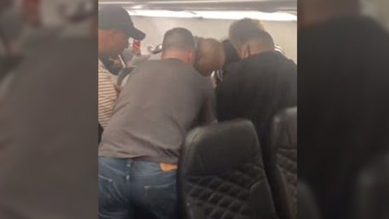 WATCH: Flight to Orlando diverted after man threatens to "kill everyone on the plane," witness says