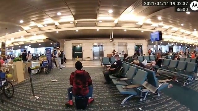 WATCH: Woman on motorized suitcase leads police on 'chase' at Orlando airport