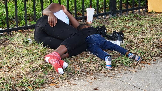 Hundreds of people waiting outside Orlando immigration facility hoping to book appointments