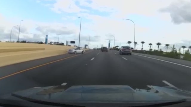 Watch: Alleged street racer speeds down Florida interstate, spins out, and crashes
