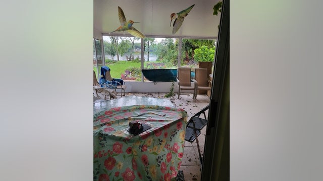 Canoe crashes into Florida home after strong winds lift it through window