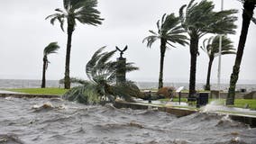 Woman visiting Florida killed after being pulled into ocean by storm surge wave from Hurricane Ian