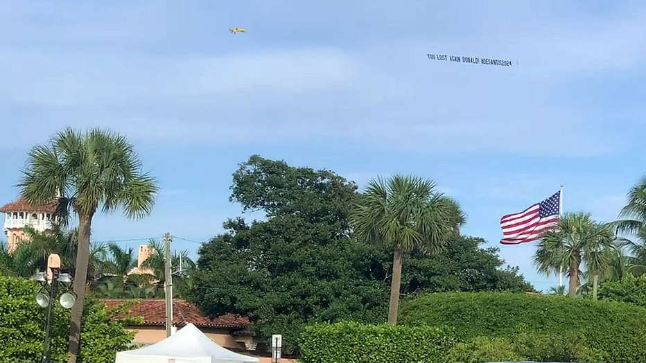 2da8fa3e-WOFL-Trump-mocking-plane-banner2.jpg
