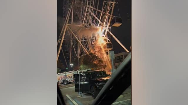 VIDEO: Sparks fly at The Wheel at ICON Park as ride loses power | 'It's on fire'