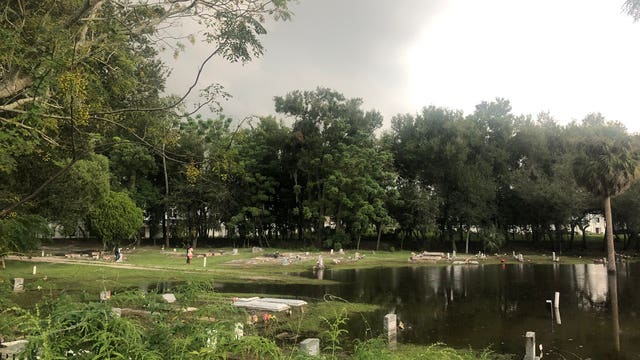 Lawsuit alleges developers knowingly flooded cemetery where caskets were unearthed