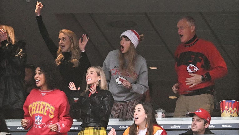 FILE - Brittany Mahomes (back row 2nd L), Taylor Swift, and Scott Swift cheer while watching the game between the Kansas City Chiefs and New England Patriots at Gillette Stadium on Dec. 17, 2023, in Foxboro, Massachusetts. (Photo by Kathryn Riley/Getty Images)