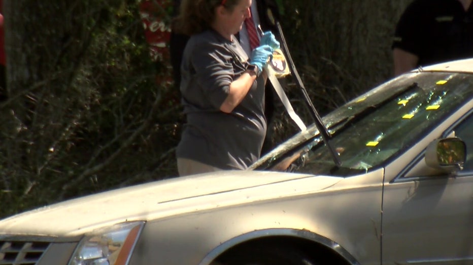 There were more than a dozen bullet holes in the suspect's windshield.