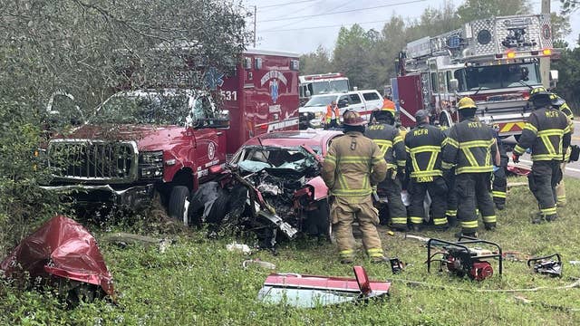 Driver cut from car after crash with ambulance in Marion County